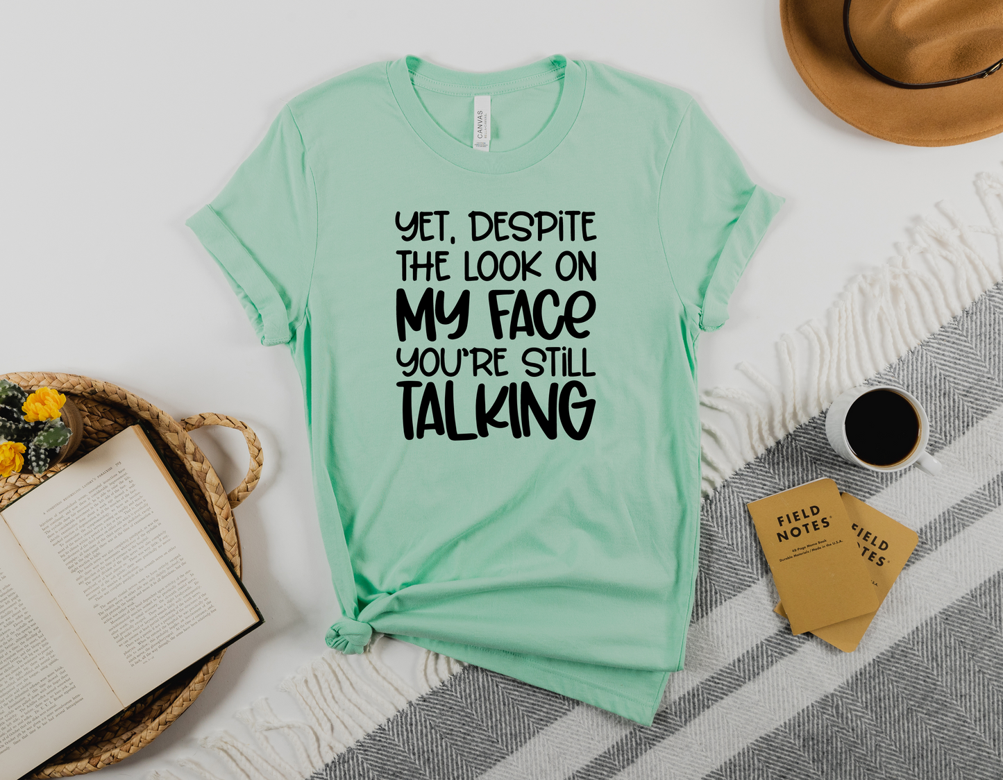 Make a Bold Statement with Our 'Yet Despite The Look On My Face, You're Still Talking' T-Shirt - Order Now!