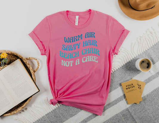 Relax and Unwind with Our "Warm Air, Beach Chair, Not A Care" T-Shirt - Order Now!