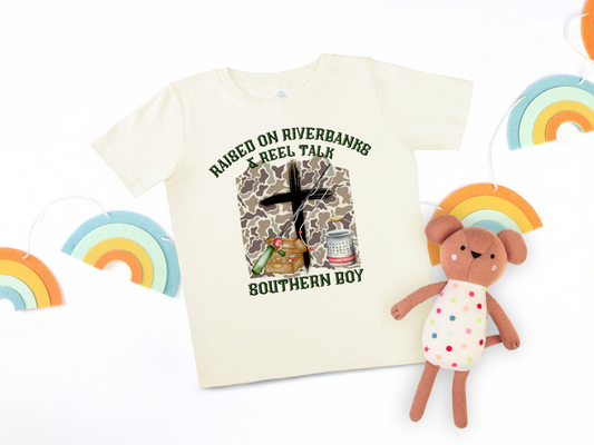“Raised on Riverbanks & Reel Talk” Southern Boy T-Shirt – For the Littlest Fisherman 🎣
